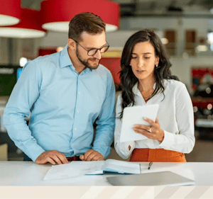 Coworkers discussing a document