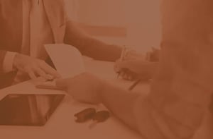 Person filling out vehicle service contract